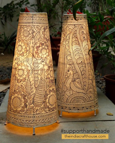 This beautifully crafted set of hand painted lamp shades are a lovely home accent, to add that extra touch of class to your decor. The translucent leather painting art form from Andhra Pradesh was originally used to make puppets for the popular shadow-puppet theatre tradition of Andhra Pradesh -‘Tholu Bommalata’- literally meaning “the dance of leather dolls Tholu Bommalata Designs, Lamp Painting Ideas, Lamp Shade Painting, Indian Lighting, Leather Lamps, Creative Lamps Diy, Painted Lamp Shades, Standing Lamp Shade, Tholu Bommalata