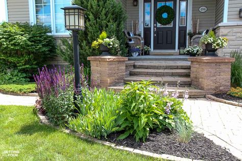 How to add curb appeal to a lamp post and blend it into the yard. See the amazing landscaping ideas and tips! Landscaping Around A Light Post, Landscape Around Lamp Post, Landscape Around Light Post, Lamp Posts Front Yard Landscaping, Lightpost Landscaping, Lamp Post Landscaping, Light Post Landscaping, Front Yard Lighting, Amazing Landscaping