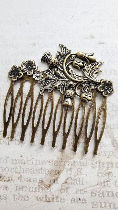 Bronze Hair Comb ♥ Ornately Beautiful ♥ Flower Hair Comb ☻Color: ~ Silver ☻Link to More Hair Accessories: https://www.etsy.com/shop/FashionCrashJewelry?ref=profile_header&search_query=hair+accessories ☻Link to The ENTIRE SHOP: https://www.etsy.com/shop/FashionCrashJewelry?ref=shopsection_shophome_leftnav&ga_search_query=crystal%2Bnecklace Our Motto ~ Happy Customers Are Awesome Let us know of any problems or concerns with purchases. 5star reviews and positive comments are greatly appreciated, th Thistle Plant, Antique Hair Combs, Decorative Hair Combs, Bronze Hair, Bun Holder, Vintage Hair Clips, Vintage Hair Combs, Thistle Flower, Vintage Hair Accessories