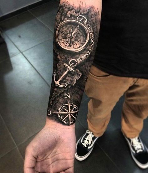 World map, compass and anchor tattoo on the arm done by @duartetattoo | www.otziapp.com Compass Forearm Tattoo, Natur Tattoo Arm, Nautical Tattoo Sleeve, Black And Grey Realism, Nature Tattoo Sleeve, Maori Tattoos, Compass Tattoo Design, Circle Tattoos, Map Tattoos