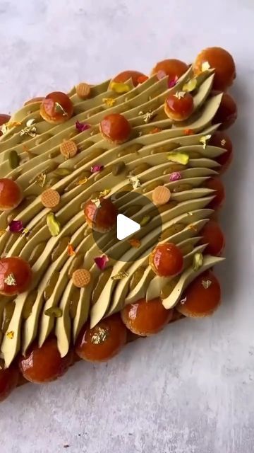 Pastry Arts Magazine on Instagram: "Baklava inspired Saint Honoré by @nourkandler ❤️ This delectable treat combines the rich flavors of pistachio from @paznuts and orange blossom filling spread in between honey caramelized filo, caramelized choux, honey cream diplomate, pistachio praline, and whipped pistachio and orange blossom ganache.😋 . . . #pastryart #pastrychef #chef #pastry #pastryporn #pastrychefs #pastrychefsofinstagram #pastrycheflife #pastrylove #pastrylover #pastrypassion #pastrylife #pastryarts #pastryinspiration #instapastry #patisserie #patisseries #dessert #desserts #dessertporn #dessertpics #pastrydesign #pastrydelights #pastryaddict #chocolatier #baker #instabaker #bakerylife #bakersofinstagram #dessertmasters" Pistachio Praline, Honey Cream, Pastry Design, Arts Magazine, Pastry Art, Chef Life, Pastry Chef, Baklava, Magazine Art