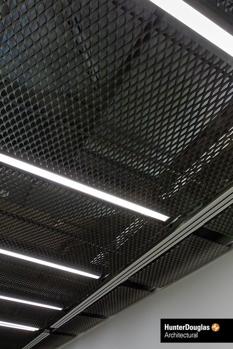 Stretch Metal Ceiling. Our focus on quality ensures the highest standard of production processes, material, machinery and finished product. The superior durability of Hunter Douglas products translates into lower costs during the life cycle of the product. #architecture #architect #ceiling #hunterdouglas Stretch Metal Ceiling, Lower Ceiling Ideas, Industrial Ceiling Design, Metal Ceiling Ideas, Metal Mesh Ceiling, Mesh Ceiling, New Yorker Loft, Decorative Ceiling Panels, محطة وقود