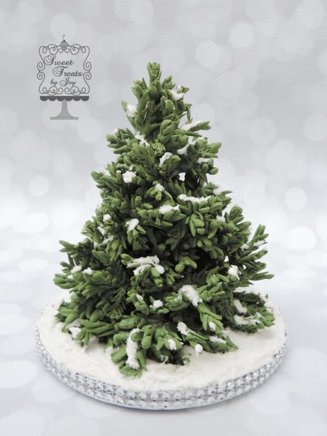 {I “love” this gumpaste Christmas Tree cake topper from Joy Thompson at Sweet Treats by Joy. “Each branch was individually wired and snipped with scissors to create a realistic look.} Decorative Cakes, Xmas Cake, Winter Cake, Tree Cake, Christmas Tree Cake, Cupcake Bouquet, Gum Paste Flowers, Tree Cakes, Fondant Figures