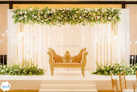 Ivory Stage Decor, Indian Wedding Simple Decorations, Engagement Back Drop Decor, Wedding Decor Stage Backgrounds, 50th Anniversary Stage Decoration, Reception Back Drop Design, 25th Anniversary Stage Decoration, Simple Sangeet Decoration Stage Indoor, Settee Back Wedding Decoration