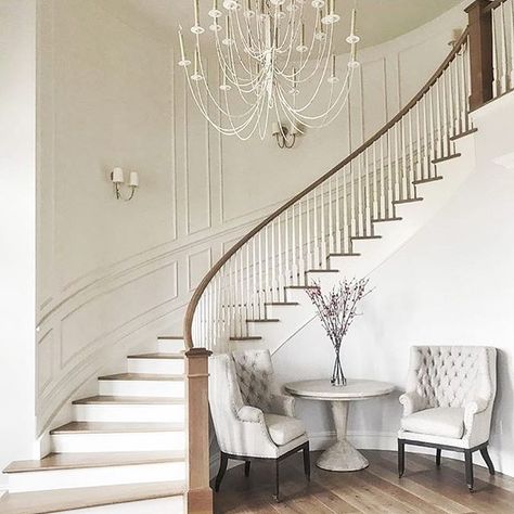 At our first meeting with our darling client we talked about her vision for a curved staircase in the entryway. And now here we are. Love how this turned out! #entrywaygoals Curved Staircase Foyer, Indoor Stair Railing, Wooden Staircase Design, درج السلم, Luxury Staircase, Foyer Staircase, House Staircase, Staircase Remodel, Stairway Design