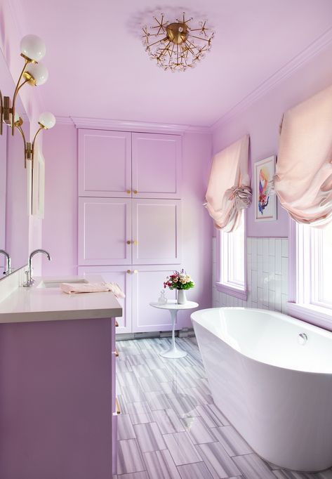 The designer transformed her young daughter's bathroom into one of the most colorful spaces in the home that exudes a style that is suitable for any age. This bold purple bathroom is stylish and can easily be changed with paint for a fresh look down the road. #hometour #homedesign #homedecor #marthastewart #inspiration #details Lavender Bathroom, Pink Dining Rooms, Decoration Hall, Purple Bathrooms, Color Lavanda, Bathroom Paint Colors, Brown Bathroom, Bathroom Color, 아파트 인테리어