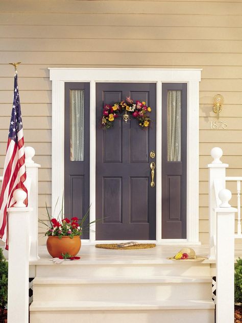 Check out DIYNetwork.com for paint colors and design ideas that will boost curb appeal and make your entry more inviting. Sw Regatta, Beige House Front Door Color, Houses Entrance, Sw Naval, Yellow Siding, Entryway Diy, Purple Front Doors, Best Front Door Colors, Tan House