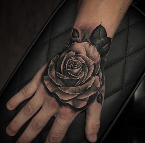 Rose Tattoo On The Hand, Black Rose Hand Tattoo Men, Rose Hand Tattoos For Guys, Hand Rose Tattoo Men, Rose Tattoo Men Hand, Angel Tattoo On Hand, Rose Hand Tattoo Men, Tattoo Rose Hand, Mens Rose Tattoo