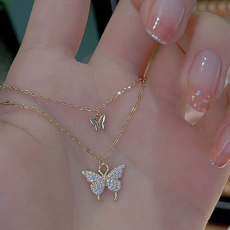 This beautiful necklace features a delicate double layer design with two butterfly pendants. It's perfect for adding a touch of whimsy and sophistication to your look. https://belsizecrafts.com/products/double-layer-butterfly-pendant-necklace #UKJewelry #UKFashion #BritishMade #UKSmallBusiness #SupportSmallBusiness #ButterflyNecklace #DoubleLayerNecklace #PendantNecklace #FashionNecklace #GiftForHer Teardrop Diamond Necklace, Minimalist Diamond Necklace, Butterfly Necklaces, Simple Pearl Necklace, Teardrop Diamond, Custom Initial Necklace, Outfit Classy, Butterfly Pendant Necklace, Neck Jewellery