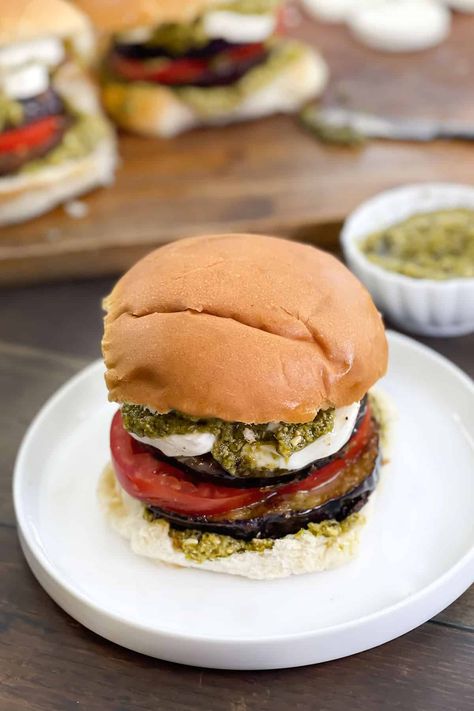 This flavorful Mediterranean Eggplant Burger has the eggplant Parmesan tastes you love, plus delicious pesto as the condiment. #veggieburger #vegetarianburgers #eggplant #eggplantparmesan  via @thecookful Mediterranean Eggplant, Eggplant Burger, Mediterranean Burger, Pan Fried Eggplant, Vegetarian Burger Recipe, Chicken Burgers Recipe, Small Eggplant, Eggplant Dishes, Vegetarian Burger