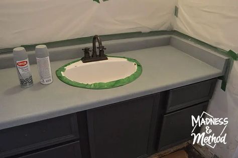 Do you have an ugly and outdated countertop? Spray painting bathroom counters is cheap and easy, and it completely transforms the look! Bathroom Counter Makeover Diy, Paint Vanity Countertop, Resurface Bathroom Countertops, Painting Vanity Countertop, Replace Bathroom Countertop, Diy Bathroom Countertop Makeover, Bathroom Counter Paint, Paint Bathroom Countertop, Bathroom Countertops Redo