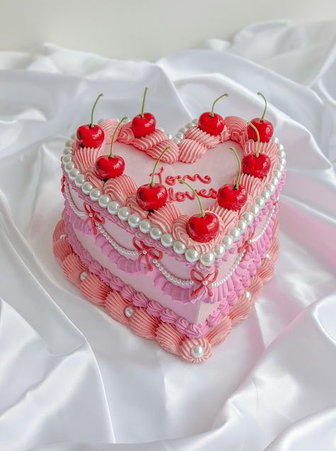 "Handmade item This delightful Heart-shaped fake cake is a treasure made to last. Colour : pale pink, pink, red, coral pink, white pearls, red cherries,  Great for photography, home decorations, props(birthdays, weddings, baby showers, movies, bakery and other shops), display, coffee table styling, shelf styling, gifts and more. Measurement : 8 to 8.5 inch width, 3 to 3.5 inch height. Taller with cherry stems.  Comes without cake board  All our products are handmade with love and care and each product has unique imperfections and we believe it add charms and beauty to the products. Handmade products may feature imperfections such as surface imperfections, tiny cracks, minor irregularities, slight variations in weight, size and colours, tiny marks and dents etc. The product you receive may Fake Cakes For Display, Fake Cake Ideas, Pink And Red Birthday, Plaster Cake, Fake Birthday Cake, Cake With Pearls, Styling Shelf, Fake Cakes, Clay Cake