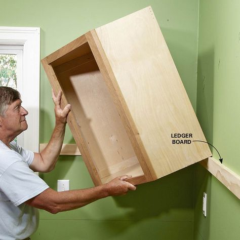 Tips for installing box cabinets successfully. Learn how to hang kitchen wall cabinets and install island cabinets with these pro tips. Install Cabinets, Estate Kitchen, Pallet Cabinets, Installing Kitchen Cabinets, House Storage, Diy Dresser Makeover, Basement Finishing, Kitchen Wall Cabinets, Diy Accent Wall