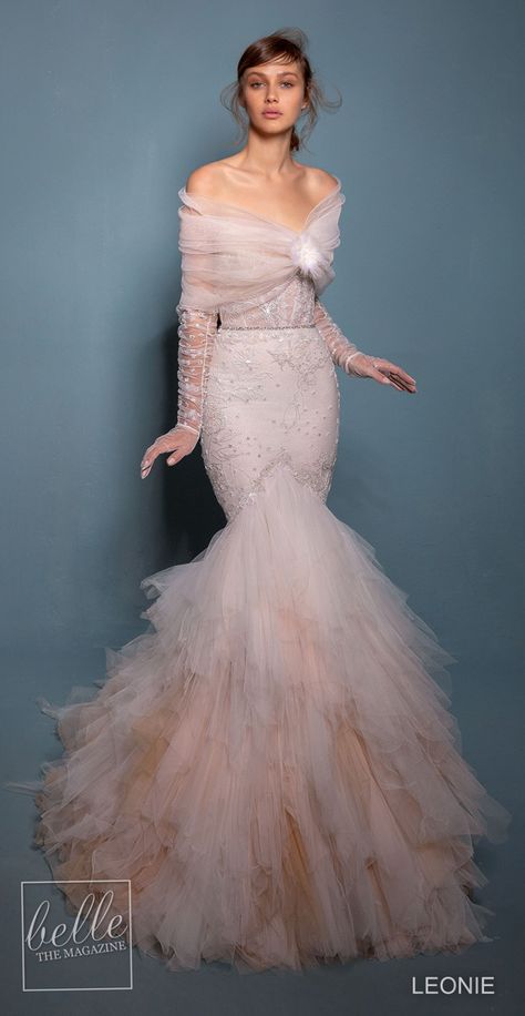 Leonie Wedding Dresses 2020 -Violet | Blush colored lace mermaid wedding dress with vintage corset bodice, sweetheart neckline, unique trumpet tulle layered skirt and paired with beautiful illusion gloves with cover up #weddingdress #weddingdresses #bridalgown #bridal #bridalgowns #weddinggown #bridetobe #weddings #bride #dreamdress #bridalcollection #bridaldress #dress See more gorgeous bridal gowns by clicking on the photo Acotar Gowns, Western Bridal Dresses, Mermaid Inspired Dress, Tulle Layered Skirt, Mermaid Bridal Gowns, Victorian Theme, Wedding Inspirasi, Bride Fashion, Wedding Dresses 2020