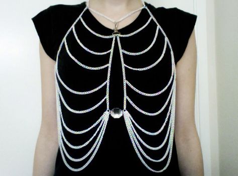 Ribcage white body chain by crumpetclothing on Etsy https://www.etsy.com/listing/96372952/ribcage-white-body-chain Skeleton Body, Body Necklace, Goth Accessories, Conceptual Fashion, Red Sunglasses, Dress Aesthetic, Diy Body, Cool Fashion, Beaded Accessories