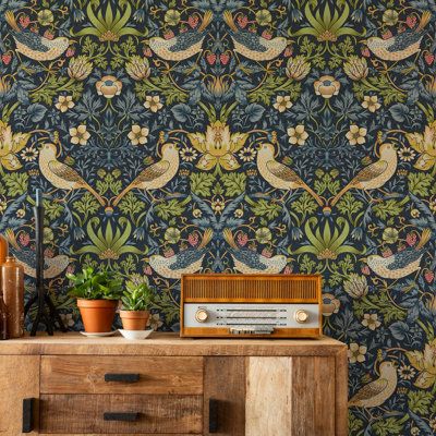 Enhance your home with the iconic 'Strawberry Thief' wallpaper by William Morris, designed in 1883. This classic design features mischievous birds feasting on nature's bounty, bringing a touch of timeless elegance and natural beauty to your space. Available in five stunning colour options—Indigo Garden, Oak Burnet, Spring Meadow, Crimson & Mistle, and Golden Quarry—this wallpaper is perfect for adding a unique and historical charm to any room. | Lark Manor Strawberry Thief Wallpaper by William M Strawberry Thief Wallpaper, Thief Wallpaper, Morris Homes, The Strawberry Thief, William Morris Wallpaper, Morris Wallpapers, Strawberry Garden, Spring Meadow, Strawberry Thief