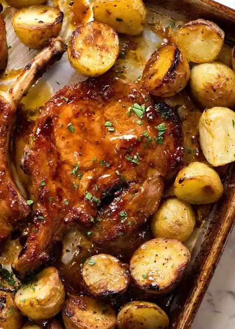 Overhead photo of Oven Baked Pork Chops, fresh out of the oven Oven Pork Chops, Easy Baked Pork Chops, Baked Pork Chops Oven, Honey Garlic Pork Chops, Pork Chops And Potatoes, Facebook Recipes, Easy Pork Chops, Pork Chop Recipes Baked, Pork Chop Dinner