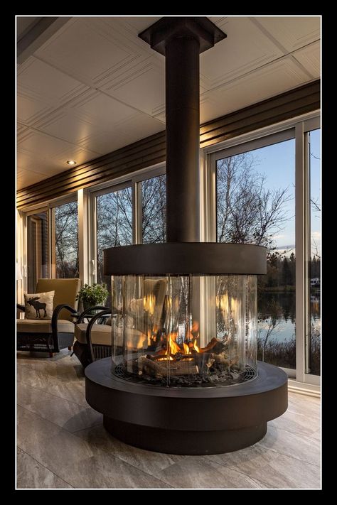 The #fireplace you always wanted for your second home in the woods - the 360 Curve from Ortal. #livingroom #interiordesign #luxuryfireplace 360 Fireplace, Indoor Wood Burning Fireplace, Decorative Hood, Curved Fireplace, Luxury Fireplace, Natural Gas Fireplace, Home In The Woods, Indoor Outdoor Fireplaces, Three Season Room