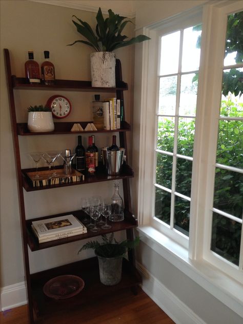 I repurposed a client's ladder shelf, which was destined for the curb, into a sleek and fun bar stand. Cocktails make everything better! Bar Shelf Ideas, Bookshelf Bar, Ladder Shelf Decor, Shelf Inspiration, Bookcase Bar, Spanish Home Decor, Bar Stand, Simple Bedroom Decor, Bar Shelves