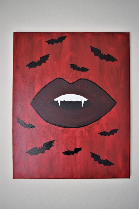 This is an original acrylic painting made by me, Sierra Miller. It is of very deep cherry vampire lips with cute little black bats around it. This painting is on a 20"X16" stretched canvas.  I started out painting by sketching out the lips. I then mixed together a very beautiful deep red to make it a nice dark vamp lip. Once I was done with the first layer for the lip, I then went in and painted the background a blood-red. after that was done, I then went back in on the lips. Painting a few more Painting On Black Background Ideas, Spooky Easy Painting Ideas, Bat Canvas Painting, Vampire Lips Painting, Halloween Painting Ideas Aesthetic, Painting Ideas Red Background, Dark Canvas Paintings Easy, Spooky Cute Painting, Gothic Painting Ideas On Canvas Easy