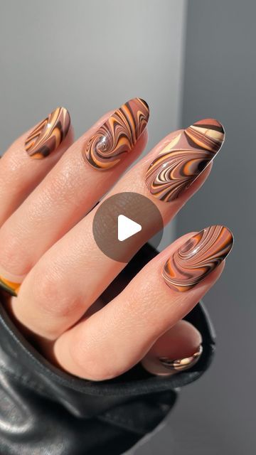 Nail Polish Society (Emiline) on Instagram: "I tried my hand at recreating @mysimplelittlepleasures Chocolate Swirl nails (YouTube tutorial). My swirls created much thinner lines than hers but I really love how the colors blended into one another. I think those brown swirls on top of the pale yellow base had such a cool effect! Would you try this out?  @holotaco Brownie Points, Ginger Snatched, Butter Me Up  Press sample  #holotaco #watermarble #nailart #cookiesandcremes #holotacocookiesandcremes #cremepolish #diynailsathome" Brown Swirl Nails, Swirls Nails, Swirl Nail Art, Swirl Nails, Holo Taco, Diy Nails At Home, Brownie Points, Chocolate Swirl, Marble Nails