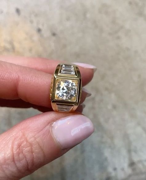 Hattie Rickards 💎 HRJ 💎 on Instagram: "🌟 SHIMMER 🌟⁠ ⁠ @lucywilliams02 s glittering HRJ engagement ring. Look at that antique round diamond sparkle!⁠ ⁠ I placed the central brilliant cut in a square setting to create a bold silhouette. Flanking it with more minimal modern step cut baguettes adds a courageous elegance. The channel set yellow sapphires bring a soft radiant glow. Perfectly reflecting Lucy in a ring!⁠ ⁠ Thank you @thecutlondon for this gorgeous video.⁠ ⁠ ⁠ #bespokeengagement #eng Lucy Williams Engagement Ring, Cool Engagement Rings, Bold Engagement Rings, Diamond And Sapphire Engagement Ring, Sapphire Engagement Ring Vintage, Wide Band Engagement Ring, Engagement Rings Channel Set, Big Engagement Rings, Square Engagement Rings