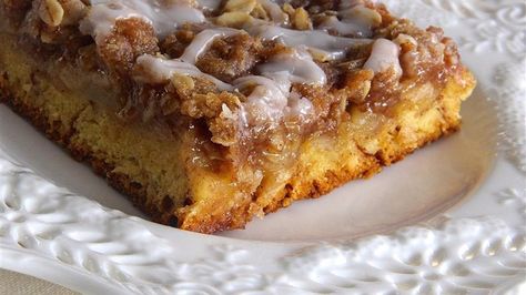 Cinnamon roll dough is the crust in this sweet apple crisp that is topped with icing for a decadent dessert for Thanksgiving or Christmas. Cinnamon Roll Crust, Cinnamon Roll Dough, Apple Crisp Recipe, Most Popular Desserts, Crisp Apple, Cinnamon Roll Cake, Apple Crisp Recipes, Popular Desserts, Cinnamon Apple