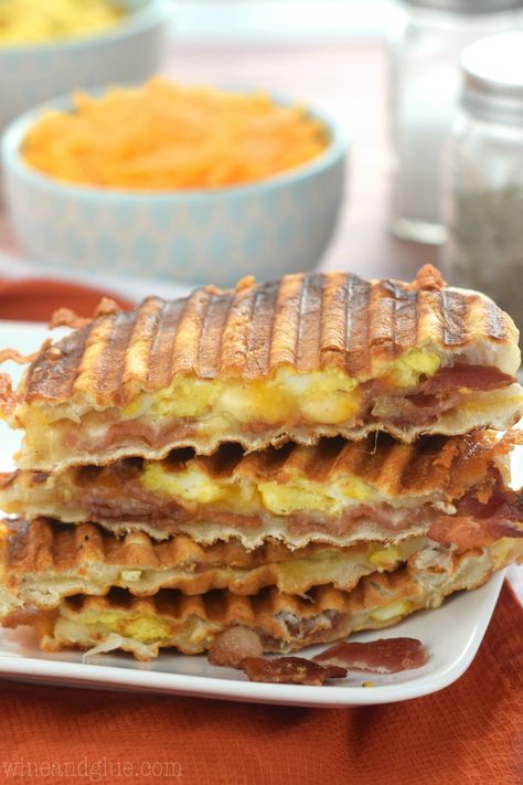 Griddling bacon and eggs between biscuit dough rounds results in an irresistible breakfast panini. Best Panini Recipes, Panini Press Recipes, Biscuit Dough Recipes, Breakfast Panini, Biscuit Breakfast, Egg Biscuits, Panini Recipes, Panini Sandwiches, Sandwich Toaster