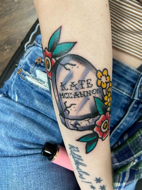 A headstone with flowers. The headstone reads “Kate McCannon” Colter Wall Tattoo Ideas, Western Traditional Tattoo Sleeve, Colter Wall Tattoo, Mama Tried Tattoo, Kate Mccannon, Headstone Tattoo, Country Song Tattoos, Gnarly Tattoos, Colter Wall