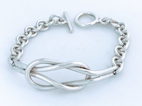 "Retro Tubular Double Knot Chain Link Toggle Bracelet.  Sturdy solid silver 28.70 gram cuff that is always in fashion. Lightly Cleaned Ready to wear.    Makers Mark: 925 stamped Weight: 28.70 grams Size: Total Inside circumference including closed is 6 3/8\" wo wrists up to that size. Knot is 2 1/4\" Long x 5/8\" wide.    Condition: Good vintage defect free ready to wear condition with standards signs of use for a vintage item.  View photos of actual item.   Please review the photos for visual d Silver Knot Bracelet, Knot Jewelry, Infinity Knot, Double Knot, Jewelry Knots, Bracelet Knots, Toggle Bracelet, Hippie Jewelry, Love Knot