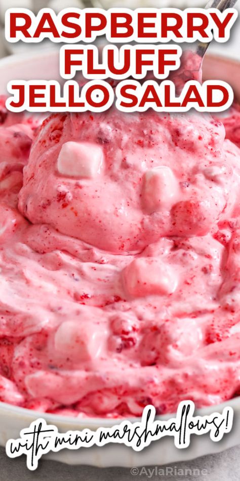 Whip up a batch of Raspberry Fluff Salad for your next gathering and watch it disappear before your eyes! This easy, no-fuss side dish or dessert combines the tangy sweetness of raspberries with creamy whipped cream and mini marshmallows for a treat that's as fun to make as it is to eat. Light, refreshing, and bursting with berry flavor, it's a visually stunning dish that promises rave reviews. via @aylarianne Raspberry Fruit Salad, Raspberry Fluff Salad Cool Whip, Berry Jello Salad, Raspberry Fluff Salad, Raspberry Fluff, Pink Fluff Salad, Fluffy Salads Cool Whip, Marshmellow Salad, Jello Fluff Cool Whip