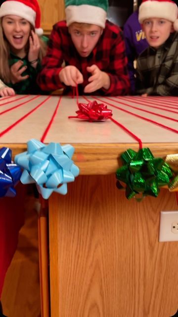 Benson Bros on Instagram: "Best Christmas party game with bows! 🎁 #games #familygames #christmas #familygamenight #christmasparty #reels #partygames #tablegames" Christmas Dinner Games Families, Easy Fun Christmas Games For Kids, Family Fun Friday Ideas, Family Christmas Party Games Funny, Kids Xmas Party Games, Family Game Night Christmas, New Years Eve Party Ideas For Family, Christmas Wrapping Game, Family Christmas Games With Prizes