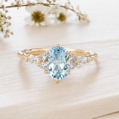 The oval-cut aquamarine stone reflects the peace and tranquility of the seas, while the marquise diamonds symbolize the eternity of your love. This elegant design combines both classic and modern styles for a unique look. Handcrafted, this ring will make your loved ones happy as a special gift. PRODUCT DETAILS ✰ Diamonds: 0.22 Carat Round & Marquise Cut ✰ Diamonds Clarity: SI F ✰ Aquamarine: 1.30 Carat Oval Cut ✰ 14K Solid Gold ✰ Rose Gold | White Gold | Yellow Gold ✰ You can choose gold color of rings. ✰ Aquamarine and diamond stones are 100% natural. ✰ Orders typically ship within 5-6 business days, excluding weekends + holidays. ✰ All orders are sent in the elegant gift box. ✰ You can see our other designs of gemstone rings in our shop. ✰ Please visit our shop: https://www.etsy.com/shop Engagement Ring With Aquamarine Accents, Aquamarine Vintage Engagement Ring, Marquise Aquamarine Ring, Blue Ring Engagement, Aquamarine Promise Ring, Aquamarine Engagement Ring Gold, Colored Engagement Ring, Engagement Rings Aquamarine, Womens Wedding Rings