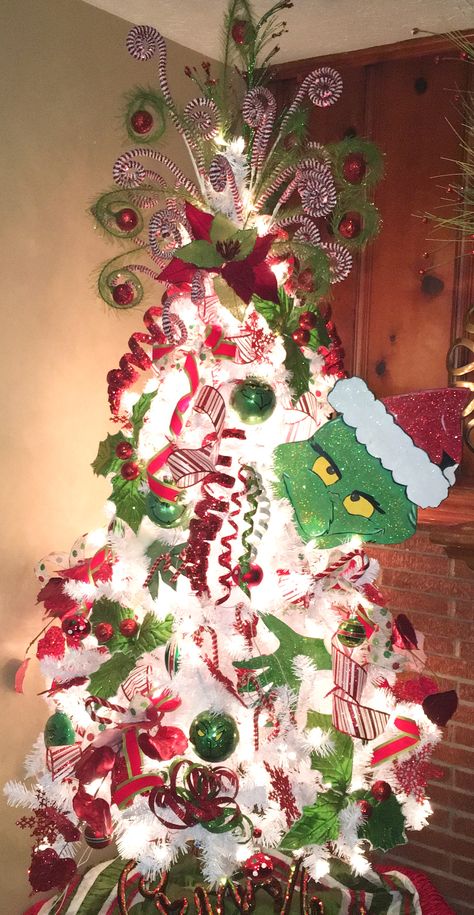 Make the best out of something. This is how you build your Christmas tree. See it here for a quick and easy way, https://ornamagic.com/shop/ornamagic-storage-case/ Christmas Tree Ideas Themed, Grinch Decorations, Grinch Trees, Disney Christmas Decorations, Grinch Christmas Party, Le Grinch, Whoville Christmas, Grinch Christmas Tree, Grinch Christmas Decorations