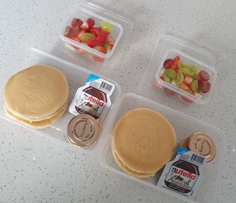 A MUM has been slammed by fellow parents for giving her kids honey and Nutella pancakes for lunch.  She proudly shared her budget-friendly lunchbox idea online, showing a snap of a stack of plain pancakes, a mini sachet of chocolate spread, a small jar of honey and some chopped up fruit.  The mum claimed it […] Pancake Box Ideas, Mini Pancakes Packaging, Nutella Lunch Ideas Kids, Lunchbox Pancakes, Mini Pancake Lunch Ideas, Pancakes Lunch Box Ideas, Plain Pancakes, Pancake Box, Mini Pancakes Cereal