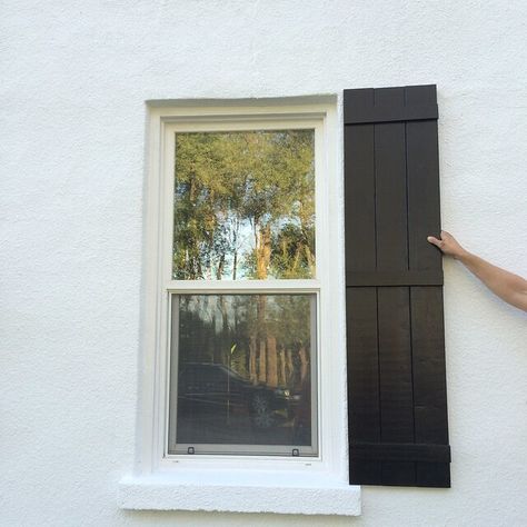 Diy Shutters Exterior Black, Black Board And Batten Shutters, Stucco Board And Batten Exterior, Diy Black Shutters, Shutters On Stucco House, Stucco House With Shutters, White House And Shutters, Shutters For White House, Cottage Shutters Exterior