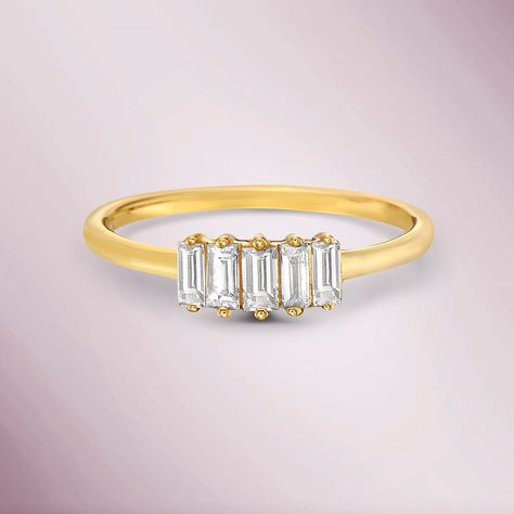 The 5 Diamonds Baguette Ring is a beautiful piece of jewelry that features five baguette-cut diamonds set in a 2-prong setting. The ring is made of 14K gold, a popular choice for its durability and resistance to tarnishing. Baguette-cut diamonds are long, narrow diamonds with rectangular or tapered ends, and they are known for their elegant and understated appearance. The 2-prong setting allows for maximum visibility of the diamonds while still providing secure and sturdy support. Metal Type: 14K Gold Gold Weight: 1. 50 gr. Diamond Weight: 0. 23 ct. Diamond Quantity: 5 Diamond Baguette Ring, Emerald Cut Solitaire Ring, Jewelry Travel Bag, Emerald Solitaire Ring, Diamond Baguette, September Birthstone Jewelry, Baguette Diamond Rings, Baguette Ring, Baguette Cut Diamond