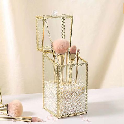 PRICES MAY VARY. WITH FREE PEARLS: The elegant makeup brush holder with a pack of free pearls. Fill the white pearls to keep the brush straight, beautiful and practical！ LUXURIOUS DESIGN :Made of super-quality tempered glass, our makeup storage box is an elegant addition to any vanity. The clean and transparent material is complemented by a hand-inlaid gold border pattern, making it the perfect storage solution for all your cosmetics. VARIOUS USAGE:The makeup brush organizer can also hold eyelin Glass Makeup, Makeup Drawer Organization, Brush Storage, Makeup Storage Box, Makeup Brush Organization, Lid Organizer, Cosmetic Display, Makeup Brush Holder, Gold Makeup