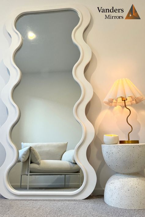 Wavy mirrors, curved mirrors or odd shaped mirrors are taking over and doubling as art within the home. These mirrors create a unique but calming environment in your home and are a must have piece in 2023. #mirror #wavymirror #curvedmirror #bathroomreno #bedroomreno #fashion #salon #hairsalon #aesthetic # Squiggly Mirror, Aesthetic Corner, Curvy Mirror, Curved Mirror, Wavy Mirror, Mirror Inspiration, Scandinavian Aesthetic, Aesthetic Room Ideas, Style Deco