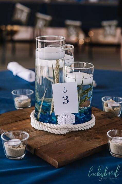 Nautical Centre Piece, Boat Wedding Centerpieces, Sailing Wedding Decorations, Sailing Centerpieces, Simple Nautical Centerpieces, Cruise Centerpieces Table Decorations, Nautical Wedding Inspiration Table Decor, Buoy Wedding Centerpiece, Nautical Flower Centerpieces