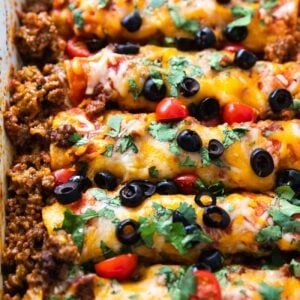 Easy Ground Beef Enchiladas Recipe - These easy beefy cheesy enchiladas are a delicious and simple dinner idea for busy families. #DinnerIdea #EasyDinner #Recipe #GroundBeef #Casserole #Hamburger Hamburger Enchiladas, Easy Ground Beef Enchiladas, Beef Enchiladas Recipe, Easy Beef Enchiladas, Beef Enchilada Recipe, Ground Beef Enchiladas, Easy Ground Beef, Enchiladas Recipe, Slow Cooked Beef