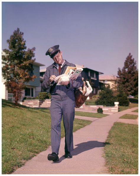 Postman Delivering Mail Suburban Neighborhood Sorting Letters Walking On Sidewalk 1964 Photo H. Armstrong Roberts Suburban Neighborhood, Radium Girls, Going Postal, Light Film, Postal Worker, Terry Pratchett, Vintage Colors, Walk On, Pose Reference