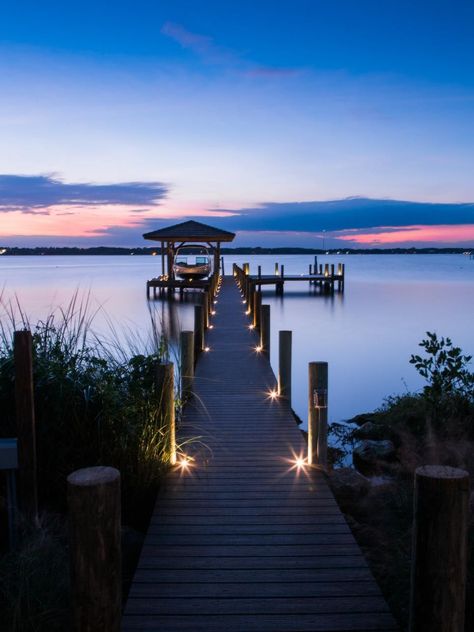 Even at night, the dock is inviting allowing guests to venture out safely. Button lights sunken into the boards illuminate the way. Hgtv Dream Homes, Lake Dock, Lakefront Living, Dock Lighting, Haus Am See, Hgtv Dream Home, Dream Beach Houses, Lan Can, Bay House