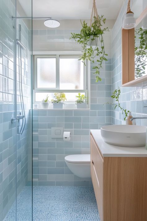 Discover sleek functionality and serene aesthetics with these modern bathroom ideas! Soft blue tiles and natural wood finishes create a calm, spa-like atmosphere. Perfect for small spaces. #ModernBathroomIdeas #InteriorDesign #HomeDecor Light Blue Tiled Bathroom, Bathroom Ideas With Blue Tile, Small Bathroom Ideas Blue Tile, Blue And Wood Bathroom Ideas, Small Light Blue Bathroom, Light Blue Tile Bathroom Ideas, Bathroom Color Tiles, Bathroom Ideas Terrazzo, Light Blue Bathroom Tile