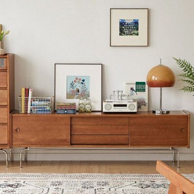 Large space storage properties | Orren Ellis Khalfani Solid Wood 70.86" W Storage Credenza Brown 21.25 x 70.86 x 15.35 in | C110917178 | Wayfair Canada Credenza Decor, Styling Shelves, Minimalist Kitchen Design, Small Apartment Living Room, Space Storage, Office Room Decor, Storage Credenza, Small Apartment Living, Living Room Flooring