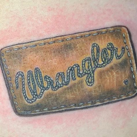 Club Tattoo Miracle Mile Shops on Instagram: “Cowboy up!! Realistic @wrangler jeans tag done by @clubtattoolasvegas resident tattoo artist @sandyai4  Is there a brand or logo that…” Wrangler Patch Tattoo, Brand Tattoo Cowboy, Western Minimalist Tattoo, Southern Tattoos Men, Men’s Western Tattoos, Wrangler Tattoo, Cow Tag Tattoo, Leather Tattoo Design, Western Tattoos For Men