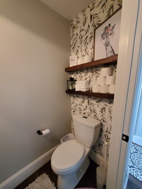 Half Bathroom Ideas With Storage, Peel And Stick Wallpaper Half Wall, Half Bath Toilet Across From Sink, Wallpaper Behind Toilet Half Baths, Floating Shelves On Wallpaper, Peel And Stick Wallpaper Behind Toilet, Magnolia Home Peel And Stick Wallpaper, Magnolia Wallpaper Bathroom, Stick And Peel Wallpaper Bathroom