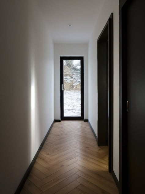 Scullion Architects embed Blackrock House in a meadow in Dundalk Black Floor Interior Design, Scullion Architects, Black Skirting, Irish Seaside, Black Interior Doors, Corridor Design, Doors Interior Modern, Hallway Designs, Black Doors