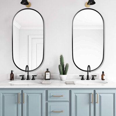 We offer a wide range of bathroom and living room wall mirrors. Beautiful oval mirrors make a better life. Oval mirrors for walls are indispensable for everyone. Our oval bathroom mirrors are suitable for a variety of home decoration styles, such as classical tradition, modern farmhouse, minimalist, industrial style, medieval, neoclassical, retro aesthetics, etc. You can freely match the style you want according to your needs. Our oval mirror bathroom comes in two finishes for you to choose from Double Oval Mirror Bathroom, Oval Bathroom Mirror Ideas, Bathroom Mirror Ideas Double Sink, Bathroom Black Mirror, Bathroom With Black Fixtures, Nickel Bathroom Mirror, Black Oval Mirror, Oval Bathroom Mirror, Master Bath Mirror