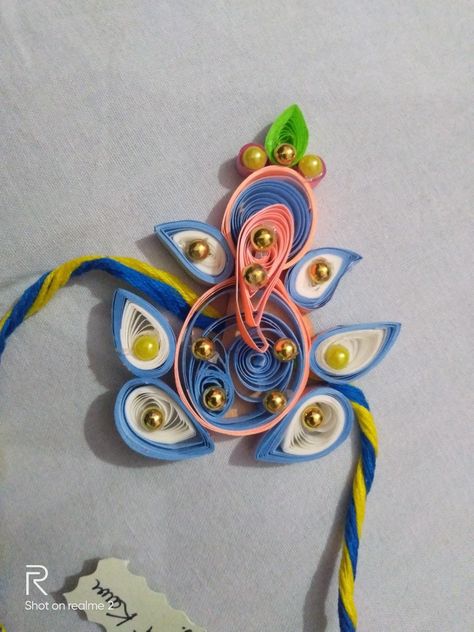 Ganesha ji Handmade rakhi Quilling Rakhi Handmade, Quilling Rakhi, Mandala Motifs, Book Crafts Diy, Handmade Rakhi, Festival Diy, Hand Embroidery Projects, Quilling Designs, Quilling Art